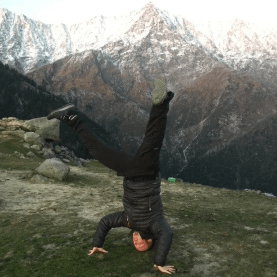 A person doing a handstand, this could be type 1 fun or type 2 fun depending on the inidvidual